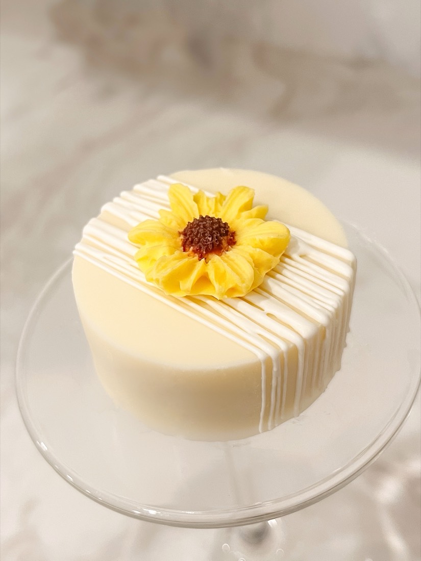 White dipped treat topped with a sunflower